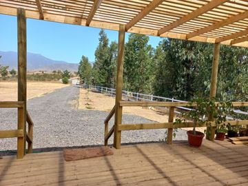 Valle Alegre, parcela 20.000 mts, cercada, con construcciones y pozo