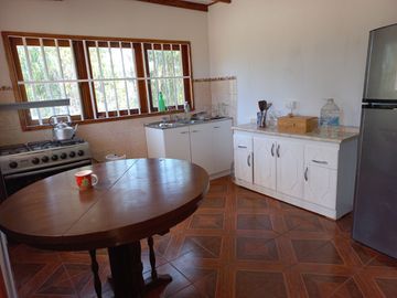 Valle Alegre, parcela 20.000 mts, cercada, con construcciones y pozo