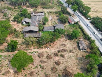 A large plot by the main road for sale in Sankhampeang, Chiang Mai