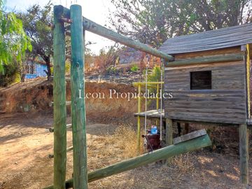 Leon Propiedades vende parcela con casa en sector las Achiras, Curacavi.