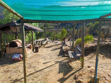 Leon Propiedades vende parcela con casa en sector las Achiras, Curacavi.